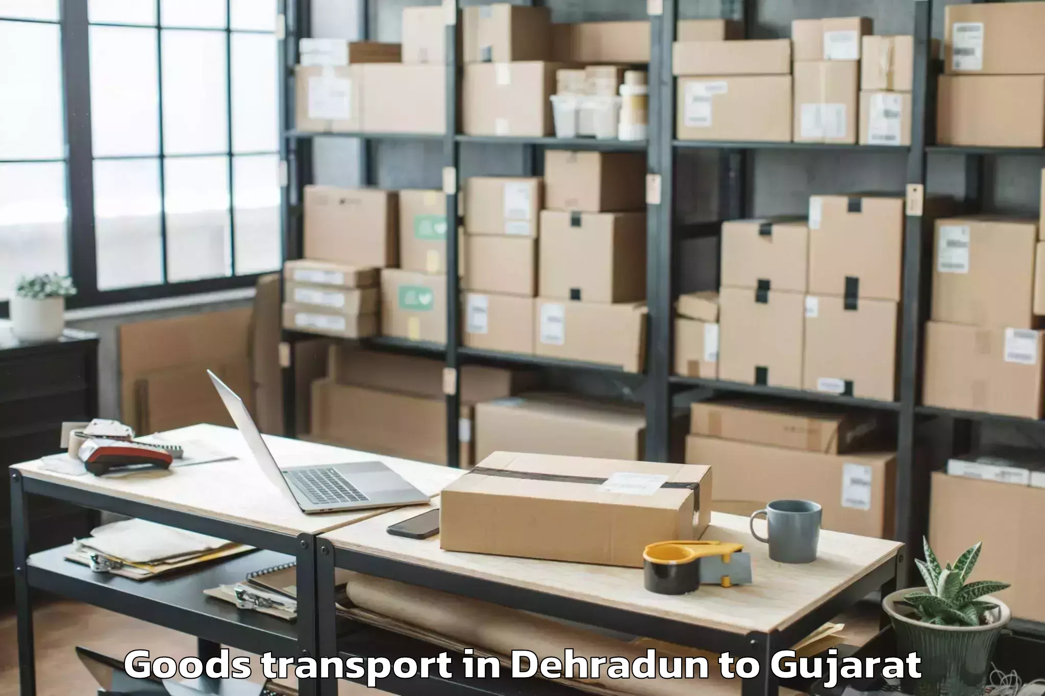 Book Dehradun to Gujarat Technological Universi Goods Transport Online